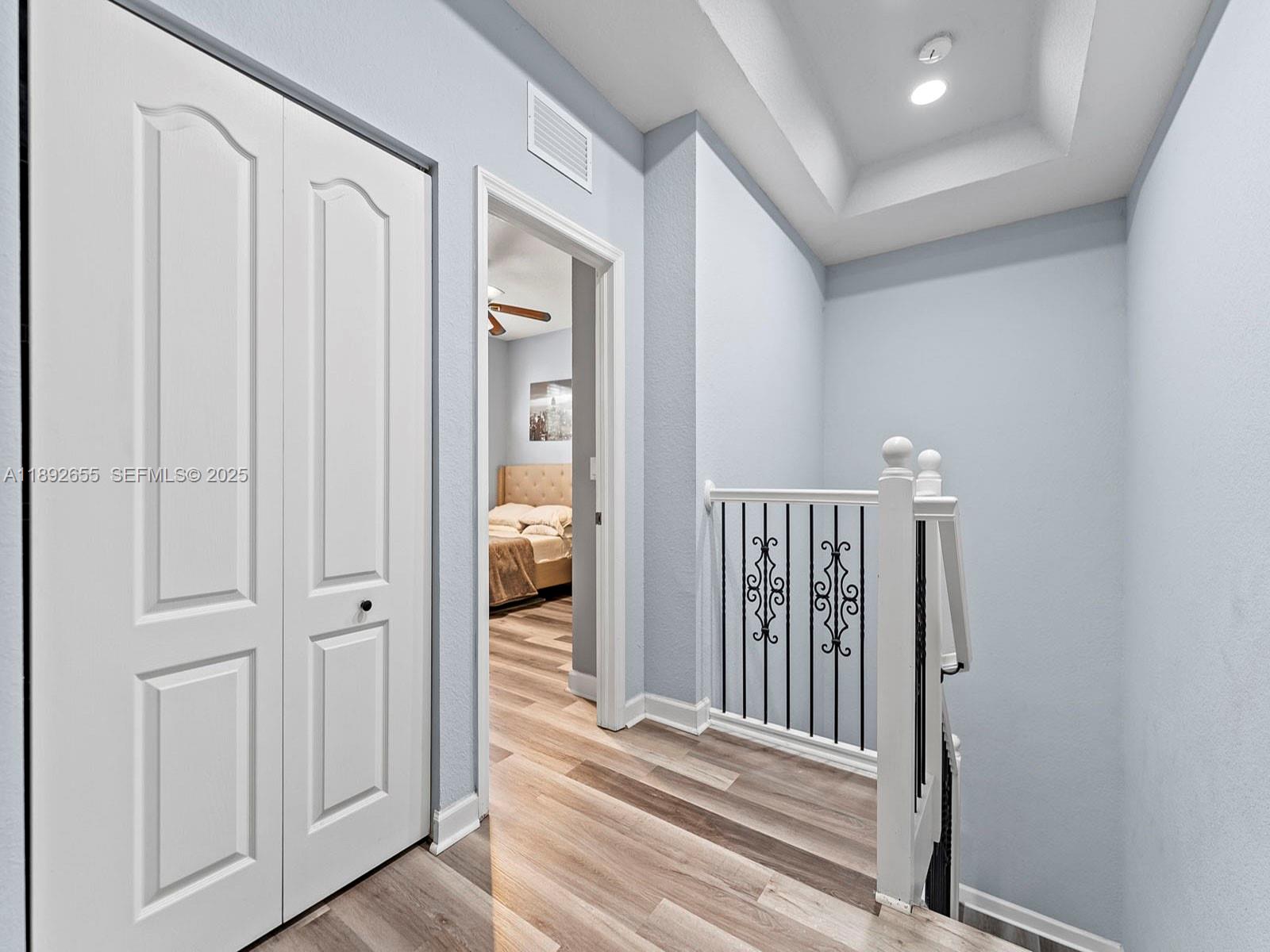 11279 Southwest 238th Street Homestead, FL 33032 - Photo 21 of 40 a view of a hallway with a door and a bathroom