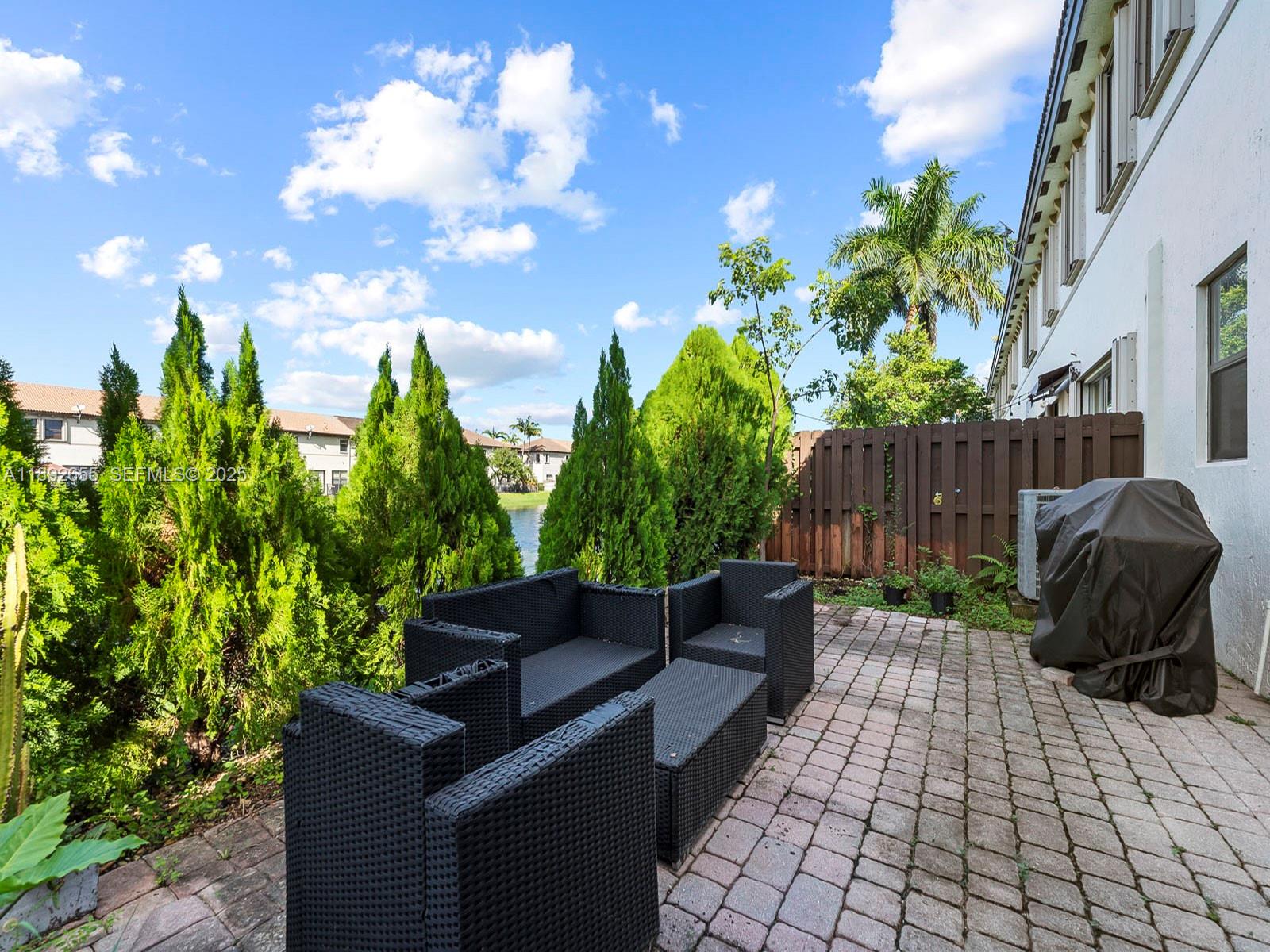 11279 Southwest 238th Street Homestead, FL 33032 - Photo 31 of 40 a view of a backyard with sitting area