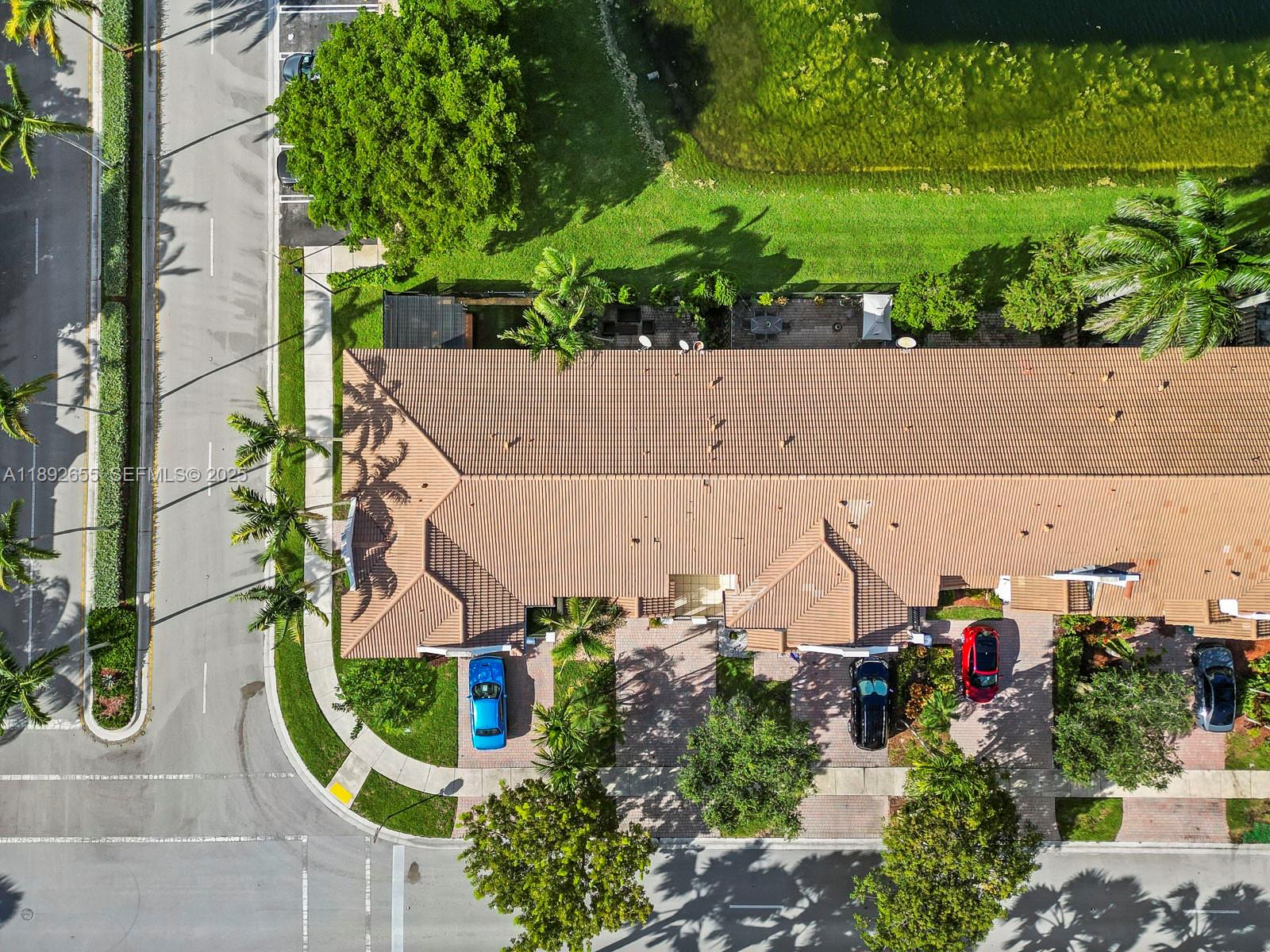 11279 Southwest 238th Street Homestead, FL 33032 - Photo 35 of 40 an aerial view of a house with a garden and a car parked