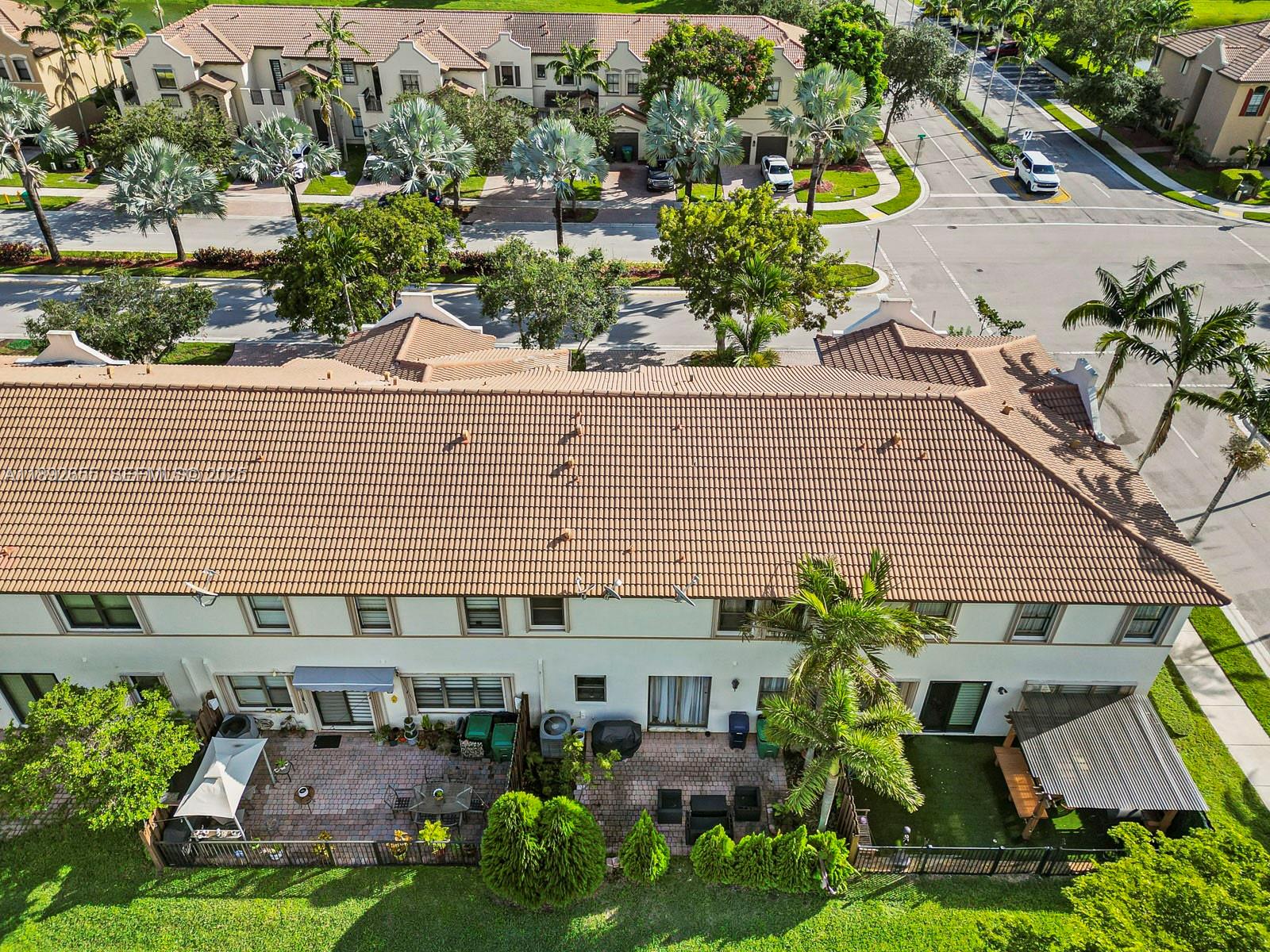 11279 Southwest 238th Street Homestead, FL 33032 - Photo 36 of 40 an aerial view of a house with a yard and potted plants