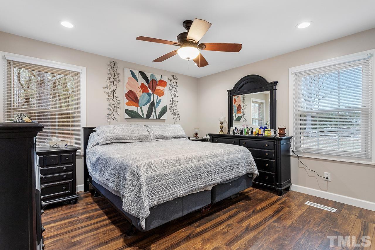 2683 C Rains Crossroads Road Selma, NC 27576 - Photo 17 of 30 a bedroom with a large bed and a window