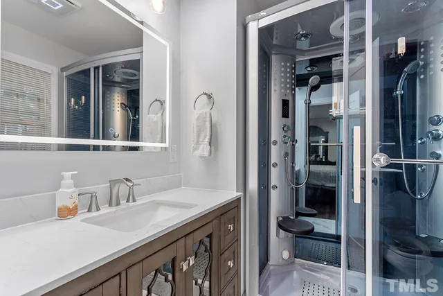 a bathroom with a sink and a mirror