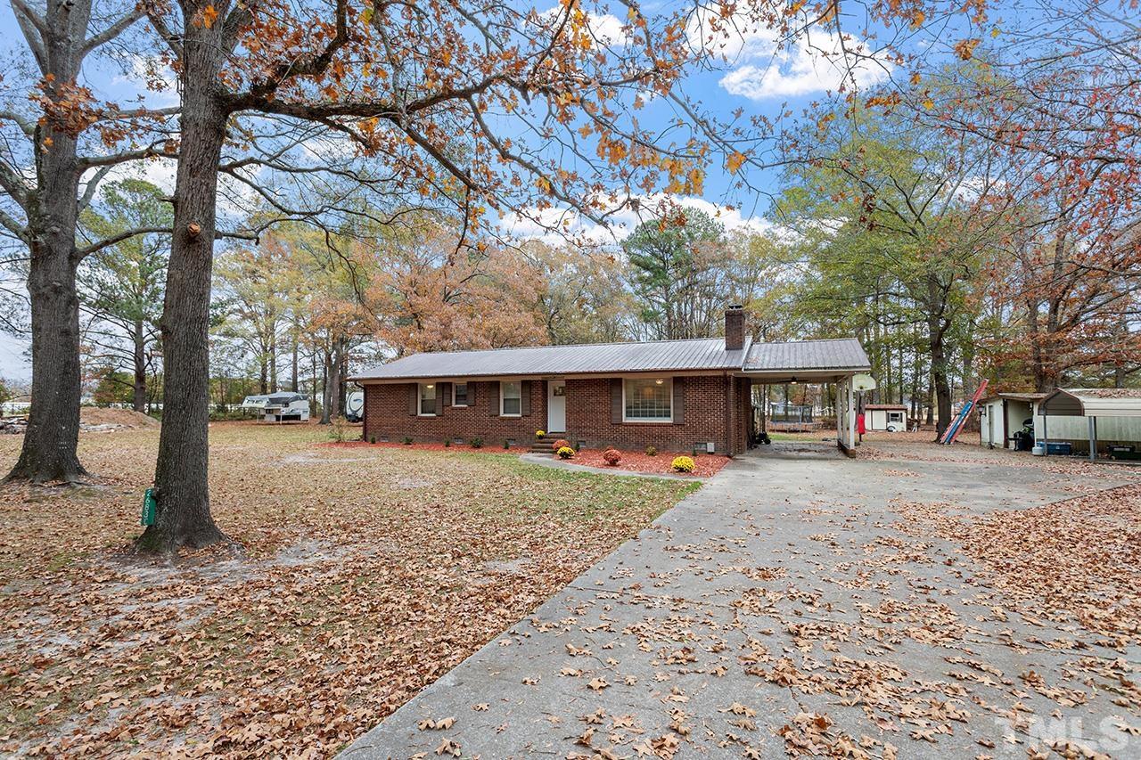 2683 C Rains Crossroads Road Selma, NC 27576 - Photo 2 of 30 a front view of a house with a garden
