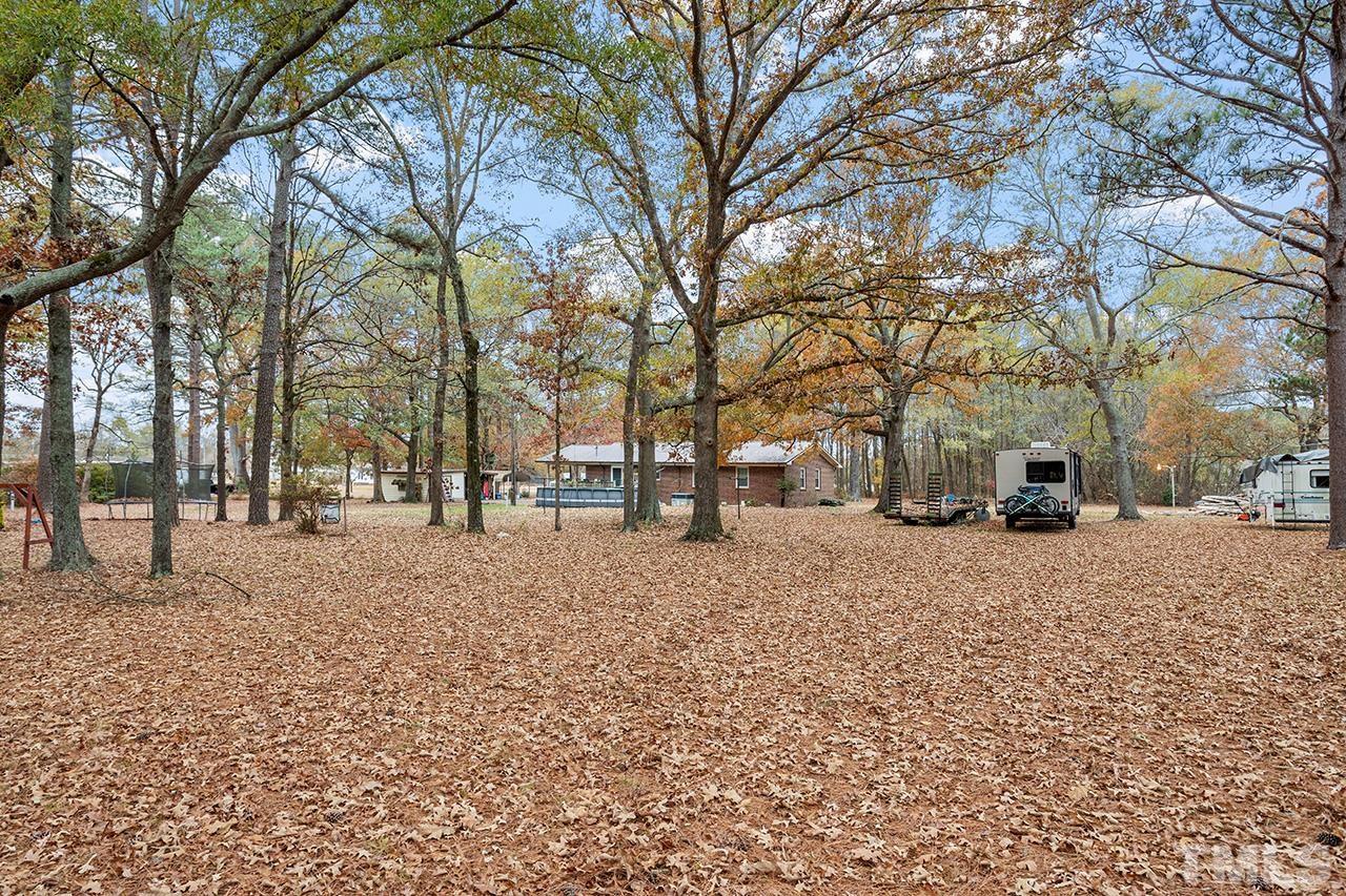 2683 C Rains Crossroads Road Selma, NC 27576 - Photo 23 of 30 a street view with large trees