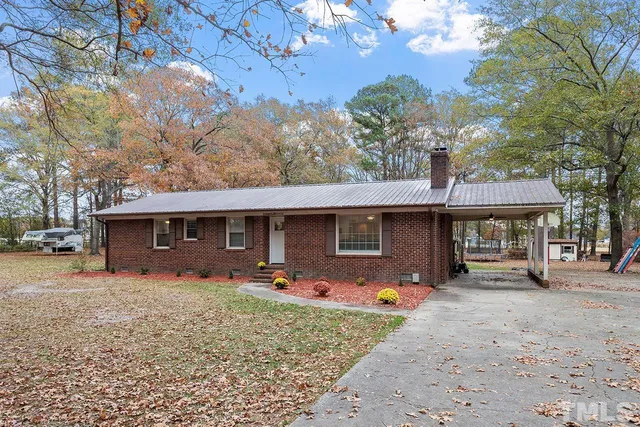 a front view of a house with swing