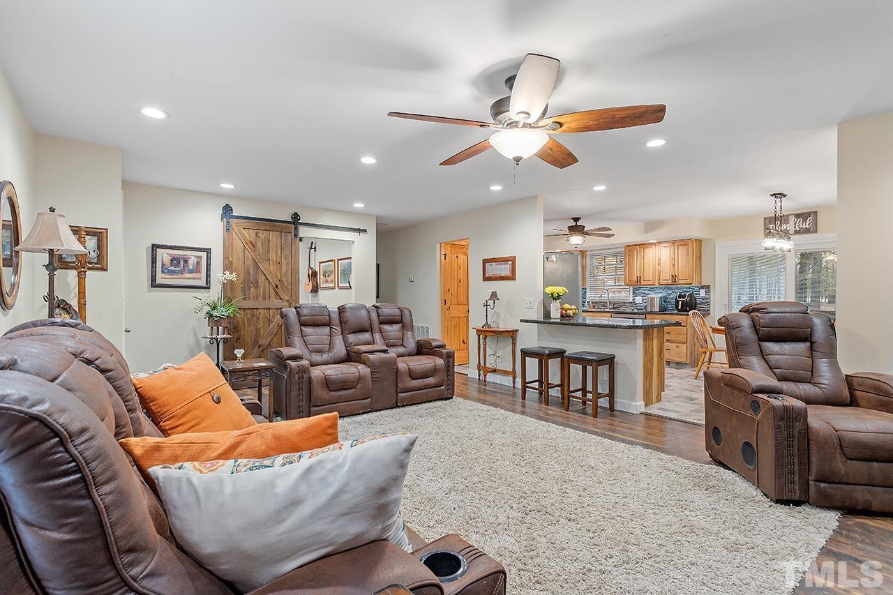 2683 C Rains Crossroads Road Selma, NC 27576 - Photo 6 of 30 a living room with furniture kitchen view and a large window