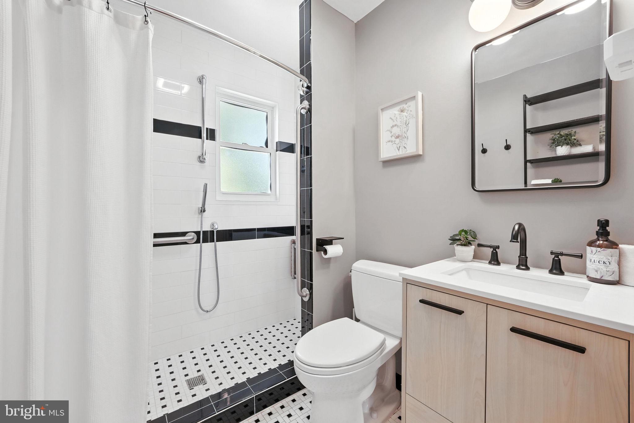 10002 Portland Place Silver Spring, MD 20901 - Photo 20 of 31 a bathroom with a sink toilet and shower