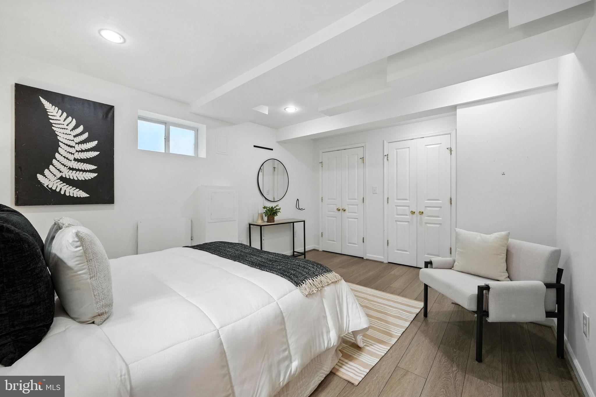 10002 Portland Place Silver Spring, MD 20901 - Photo 25 of 31 a bedroom with a bed and a chandelier