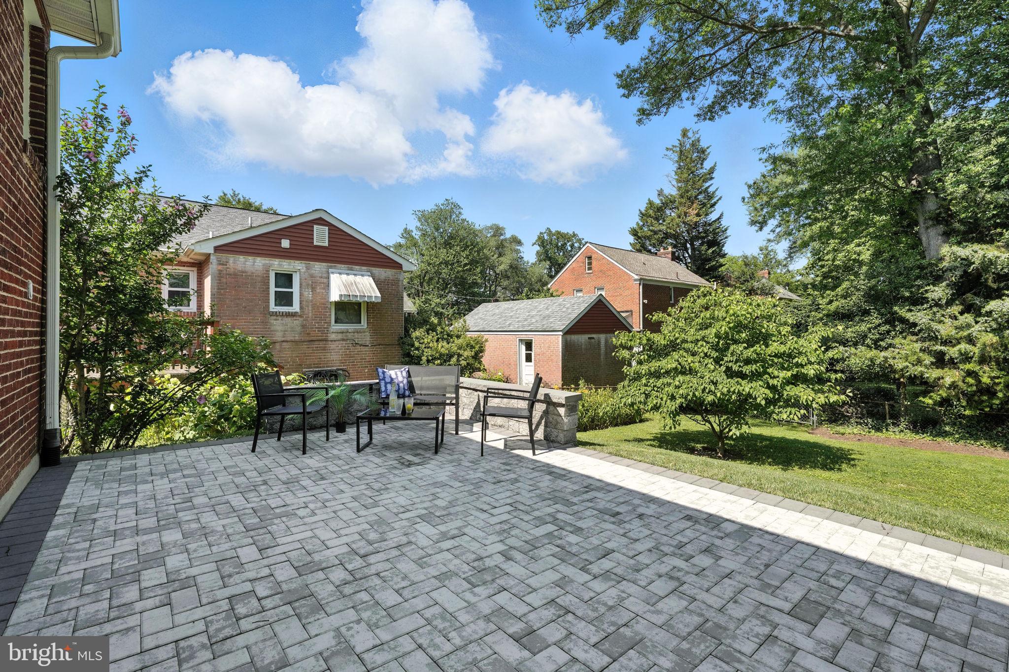 10002 Portland Place Silver Spring, MD 20901 - Photo 28 of 31 a view of a house with a yard and sitting area