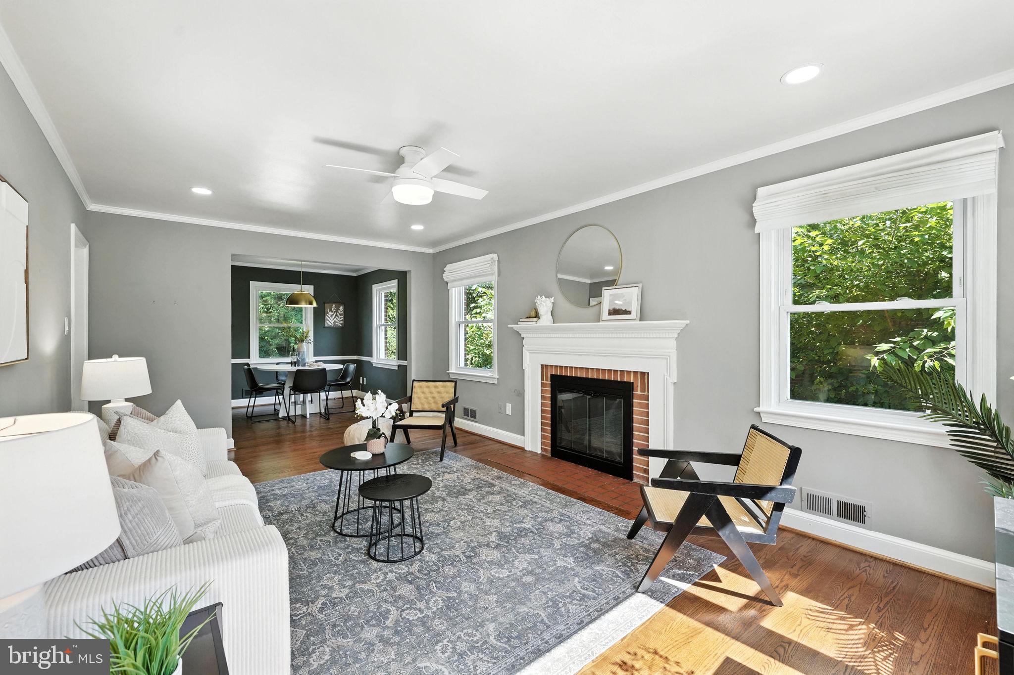 10002 Portland Place Silver Spring, MD 20901 - Photo 5 of 31 a living room with furniture a fireplace and a window