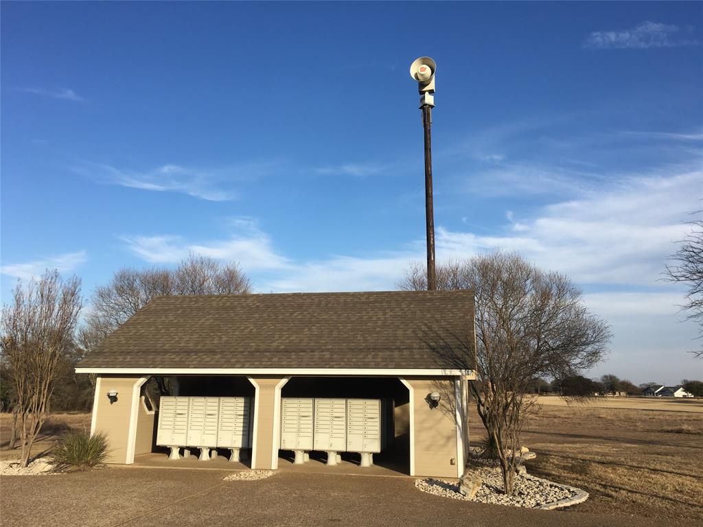 36062 Cedar Ridge Drive Whitney, TX 76692 - Photo 14 of 14 a front view of a house with a yard and garage
