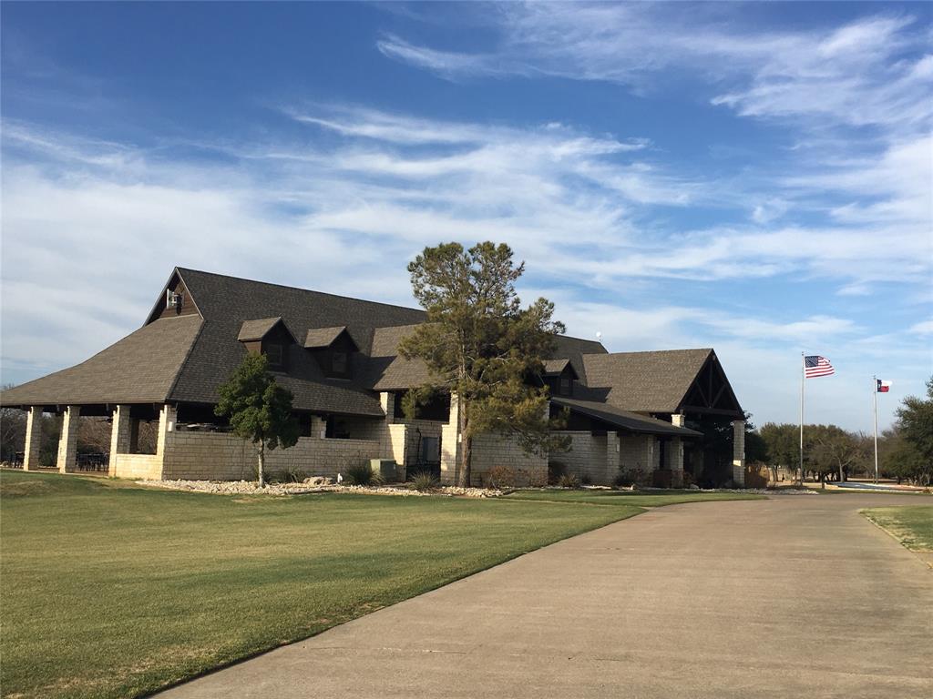 36062 Cedar Ridge Drive Whitney, TX 76692 - Photo 3 of 14 a front view of a house with a garden