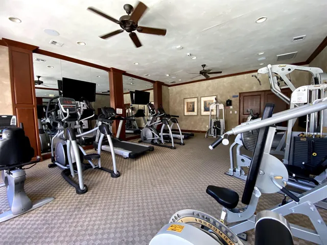 a front view of a house with a yard fire pit and outdoor seating