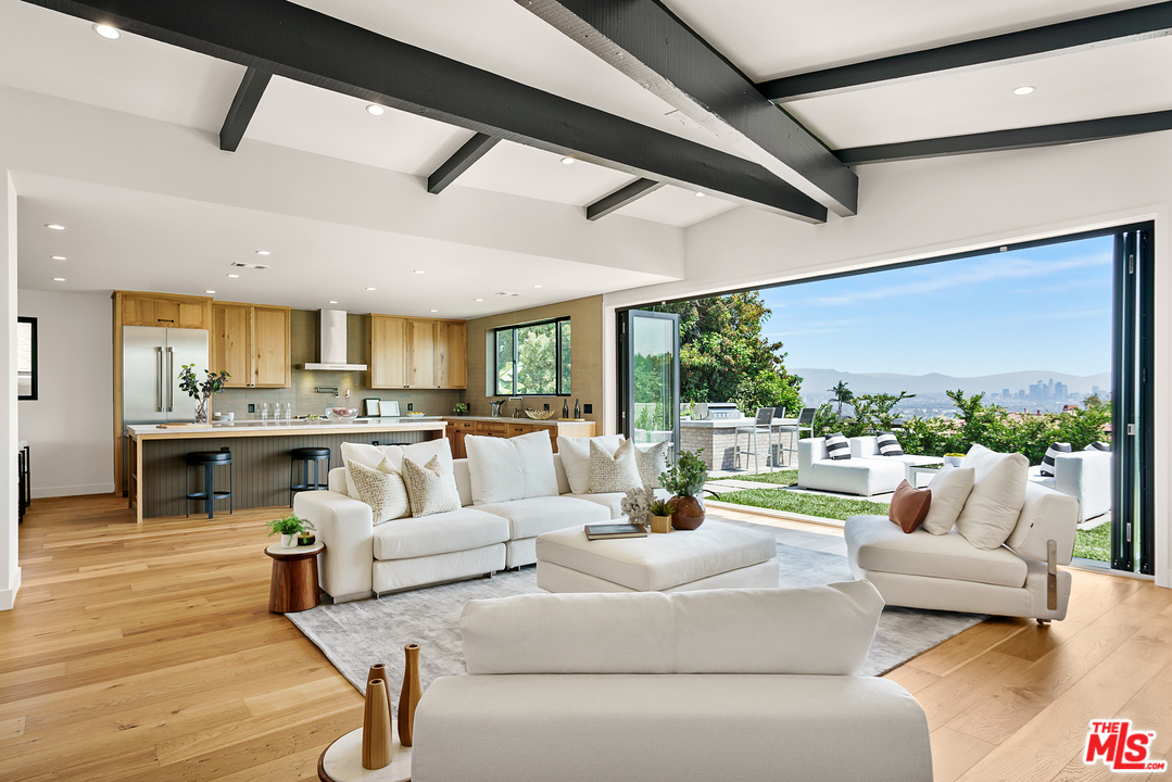 4132 Punta Alta Drive Los Angeles, CA 90008 - Photo 13 of 43 a living room with furniture and a view of kitchen