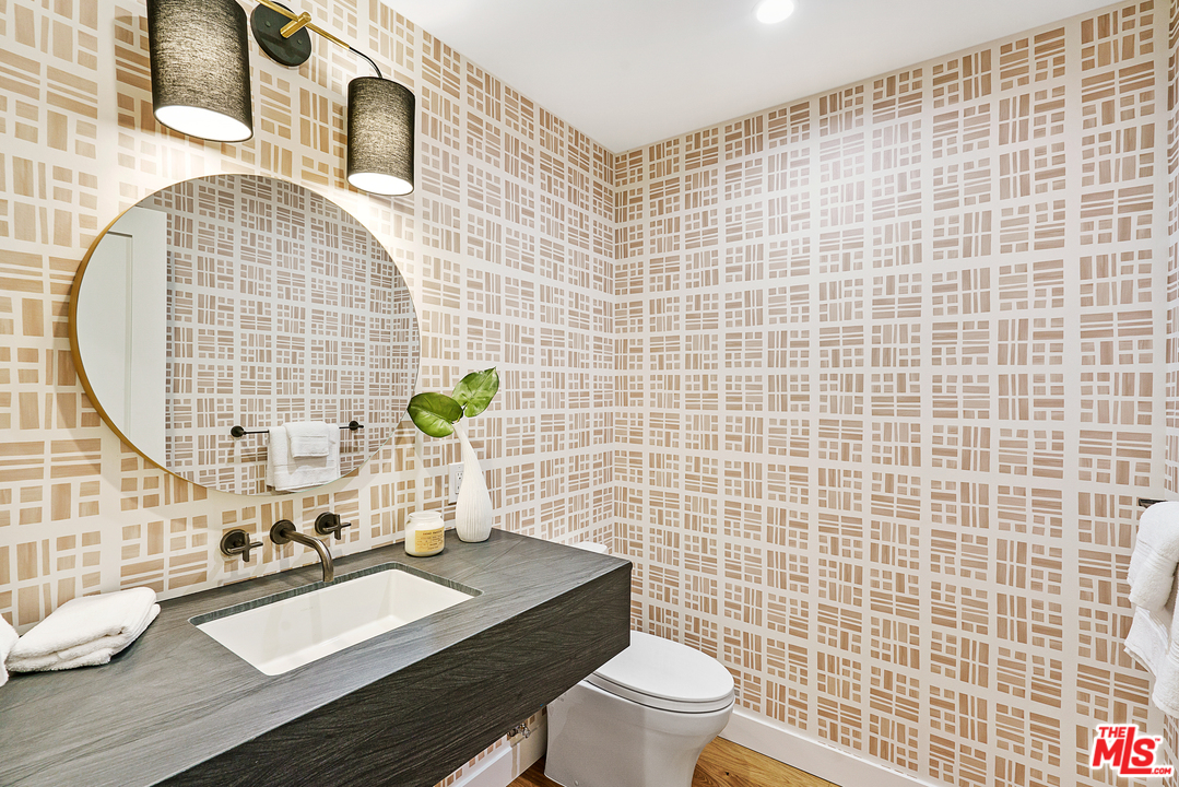 4132 Punta Alta Drive Los Angeles, CA 90008 - Photo 24 of 43 a bathroom with a sink mirror and toilet