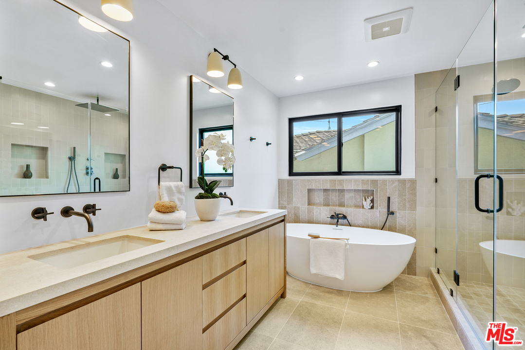 4132 Punta Alta Drive Los Angeles, CA 90008 - Photo 29 of 43 a bathroom with a double vanity sink mirror and double