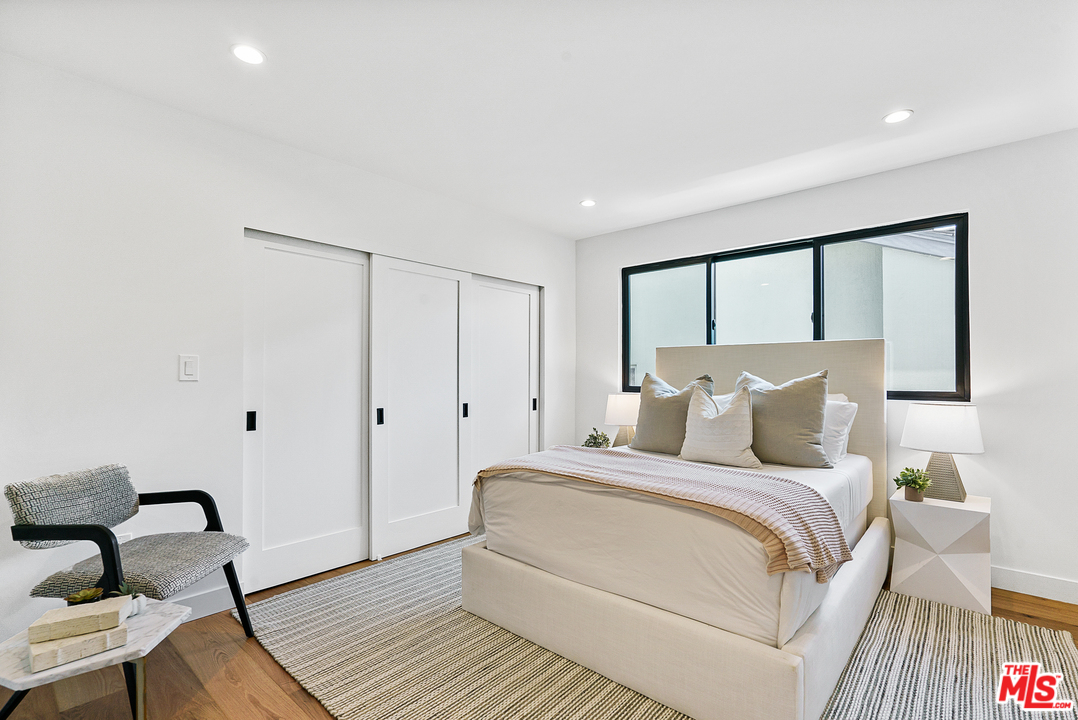 4132 Punta Alta Drive Los Angeles, CA 90008 - Photo 35 of 43 a bedroom with a bed and a mirror