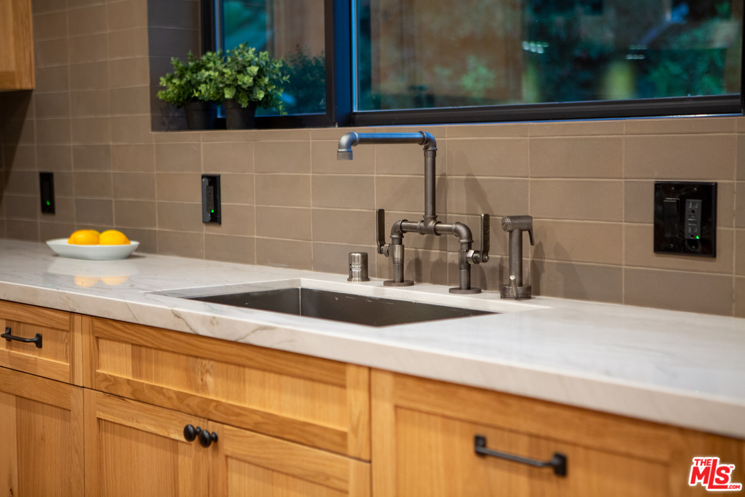 4132 Punta Alta Drive Los Angeles, CA 90008 - Photo 40 of 43 a bathroom with a sink and a mirror