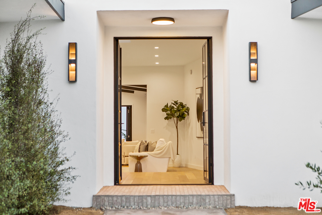 4132 Punta Alta Drive Los Angeles, CA 90008 - Photo 5 of 43 wooden floor with a mirror and a potted plant