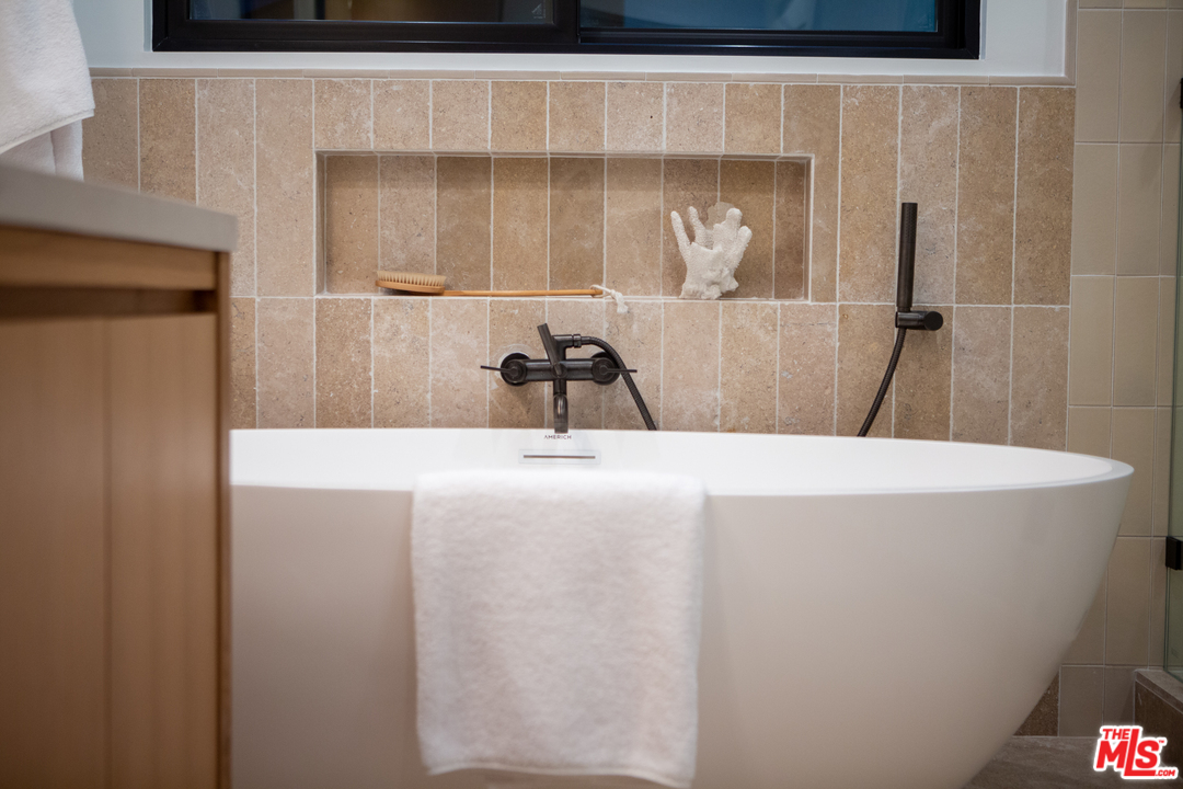 4132 Punta Alta Drive Los Angeles, CA 90008 - Photo 41 of 43 a bathroom with a sink and a mirror