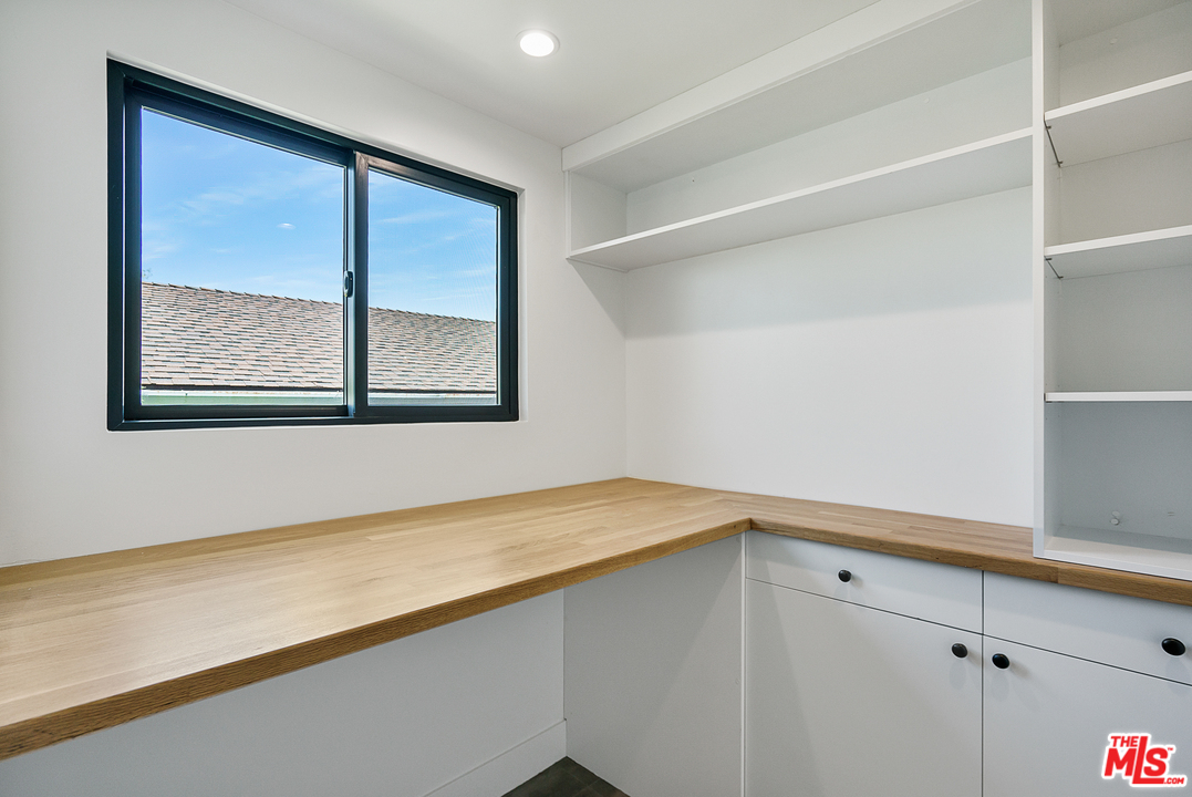 4132 Punta Alta Drive Los Angeles, CA 90008 - Photo 42 of 43 a room with a wooden floor and a window