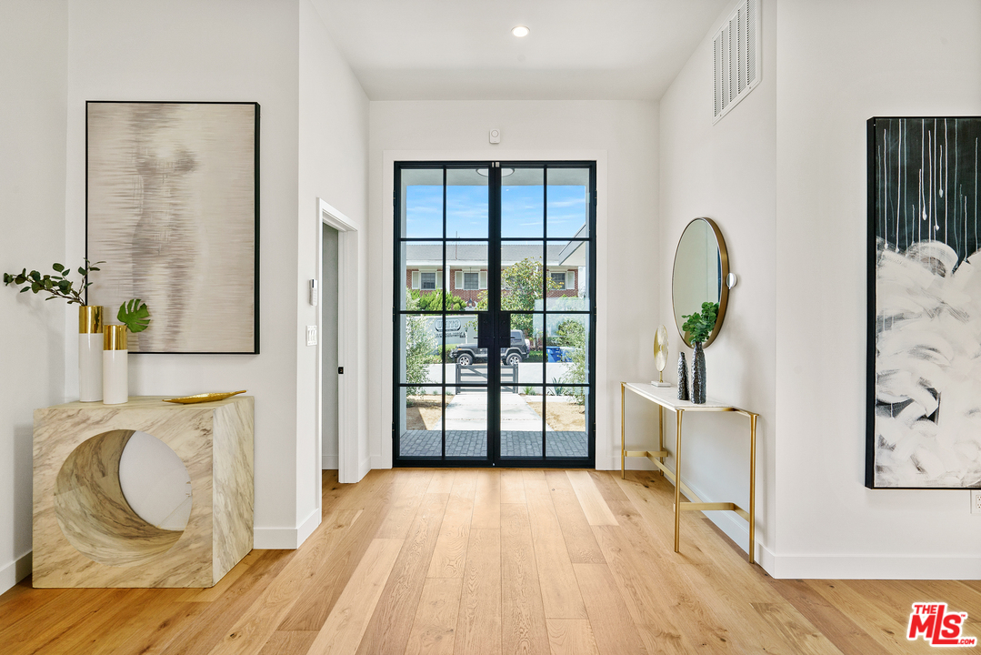 4132 Punta Alta Drive Los Angeles, CA 90008 - Photo 8 of 43 view of living room with furniture and floor to ceiling window