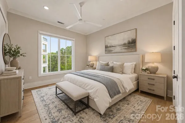 a bedroom with bed and a potted plant