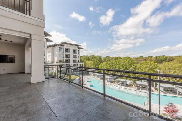 a view of swimming pool from a balcony