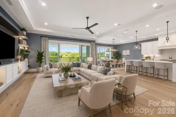 a living room with fireplace furniture and a flat screen tv