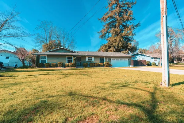 a front view of a house with a swimming pool
