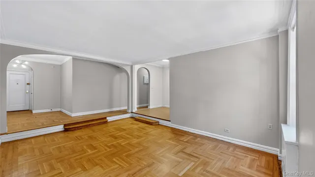 a front view of a multi story building with yard