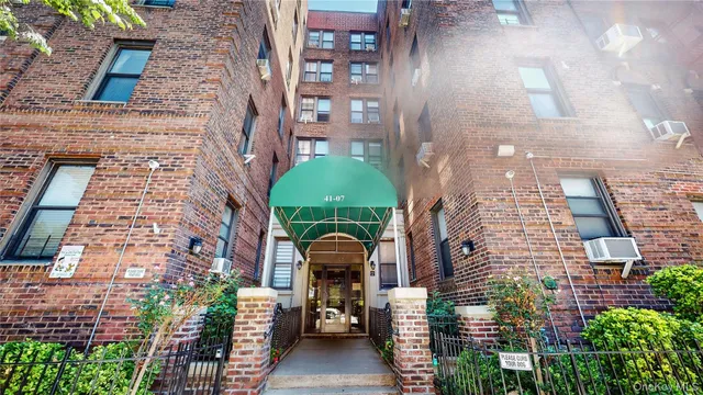 a view of a kitchen with a refrigerator a stove top oven and a refrigerator
