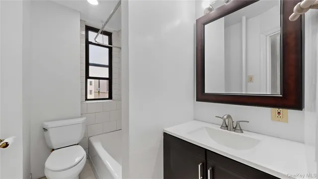 a bathroom with a bathtub and sink