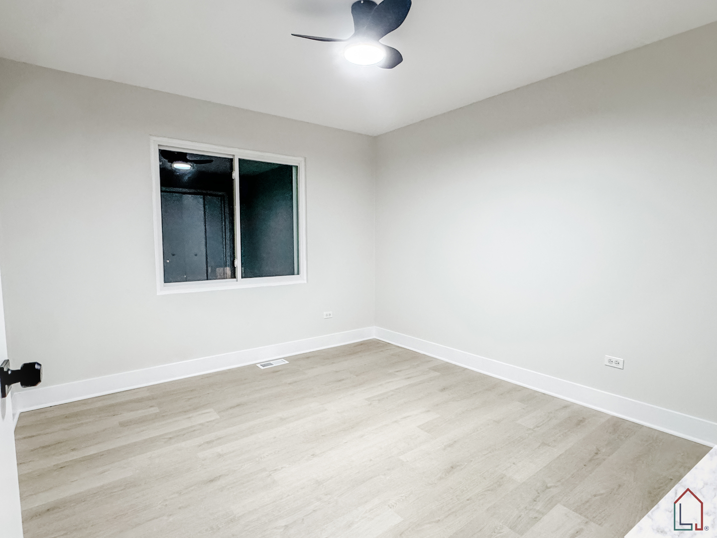 864 Berkshire Place Crete, IL 60417 - Photo 13 of 23 an empty room with a ceiling fan and wooden floor