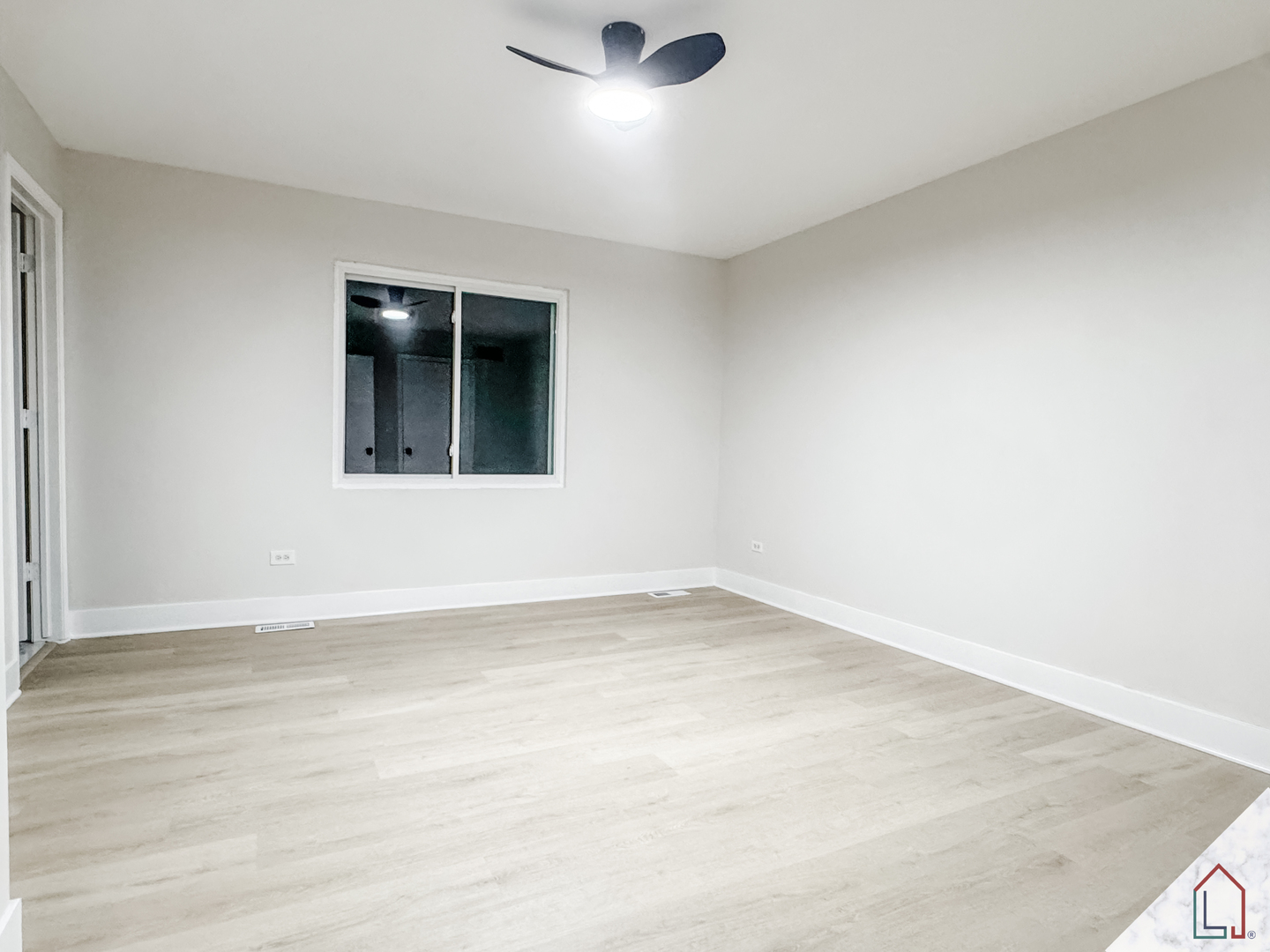 864 Berkshire Place Crete, IL 60417 - Photo 9 of 23 an empty room with wooden floor and windows