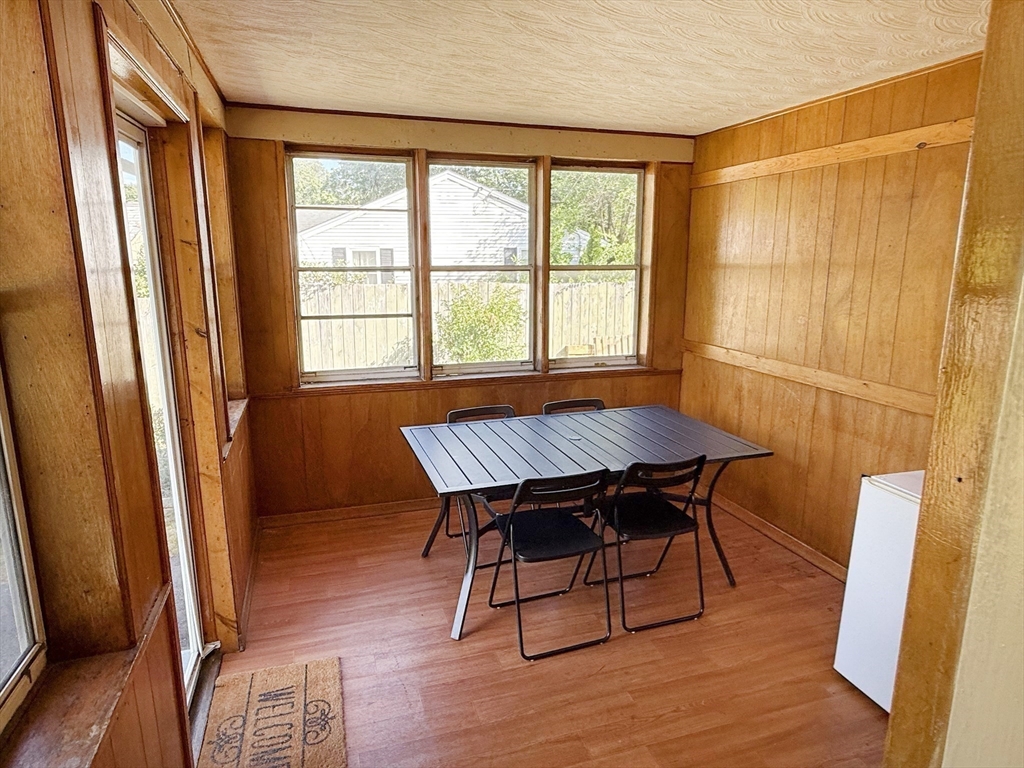 11 Webb Road Sharon, MA 02067 - Photo 12 of 19 a view of a dining room with furniture and wooden floor