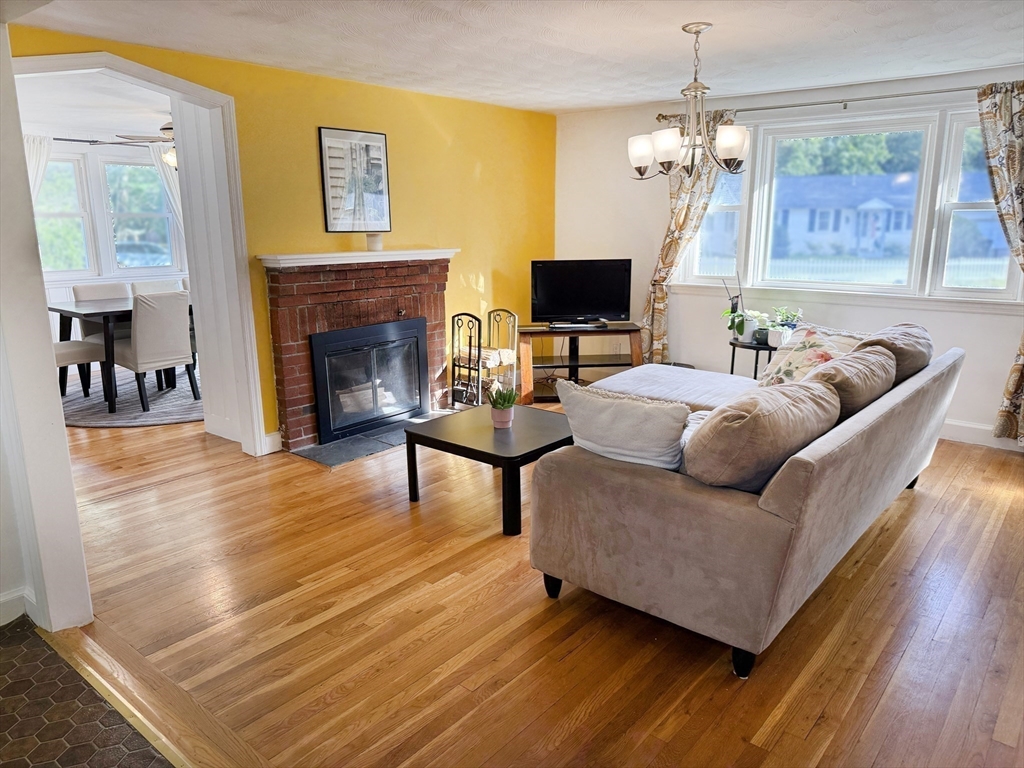 11 Webb Road Sharon, MA 02067 - Photo 5 of 19 a living room with furniture and a fireplace