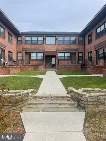 a view of a swimming pool with a garden and plants