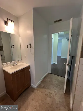 a view of a bathroom with a sink and mirror