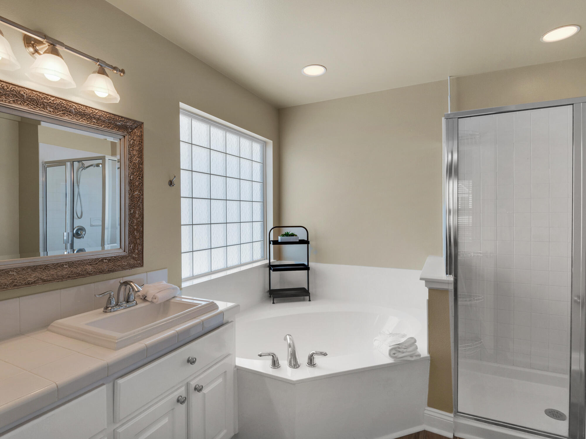 4587 Woodwind Drive Destin, FL 32541 - Photo 13 of 24 a bathroom with a sink and a bathtub