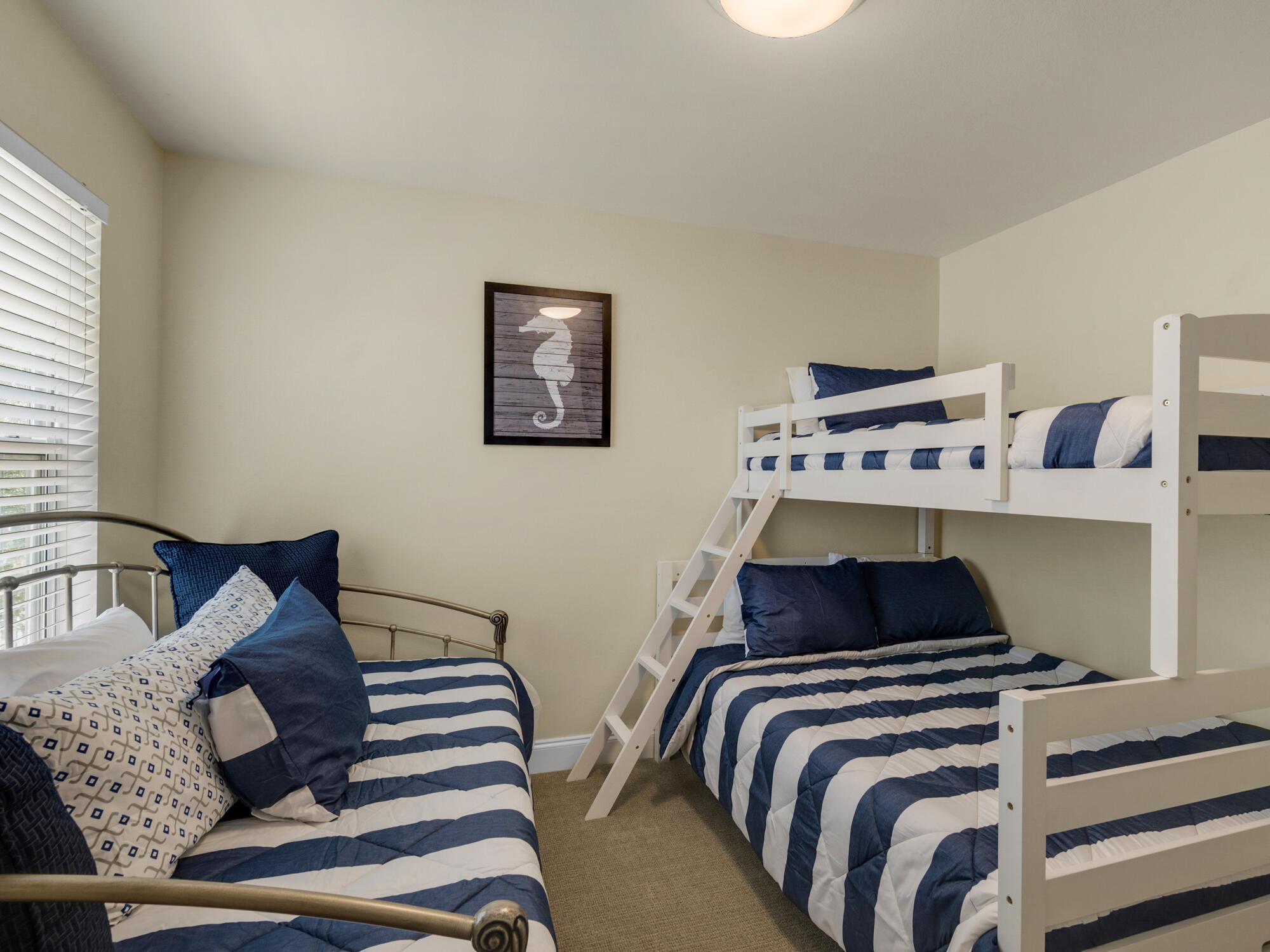 4587 Woodwind Drive Destin, FL 32541 - Photo 15 of 24 a bedroom with a bed and wooden floor