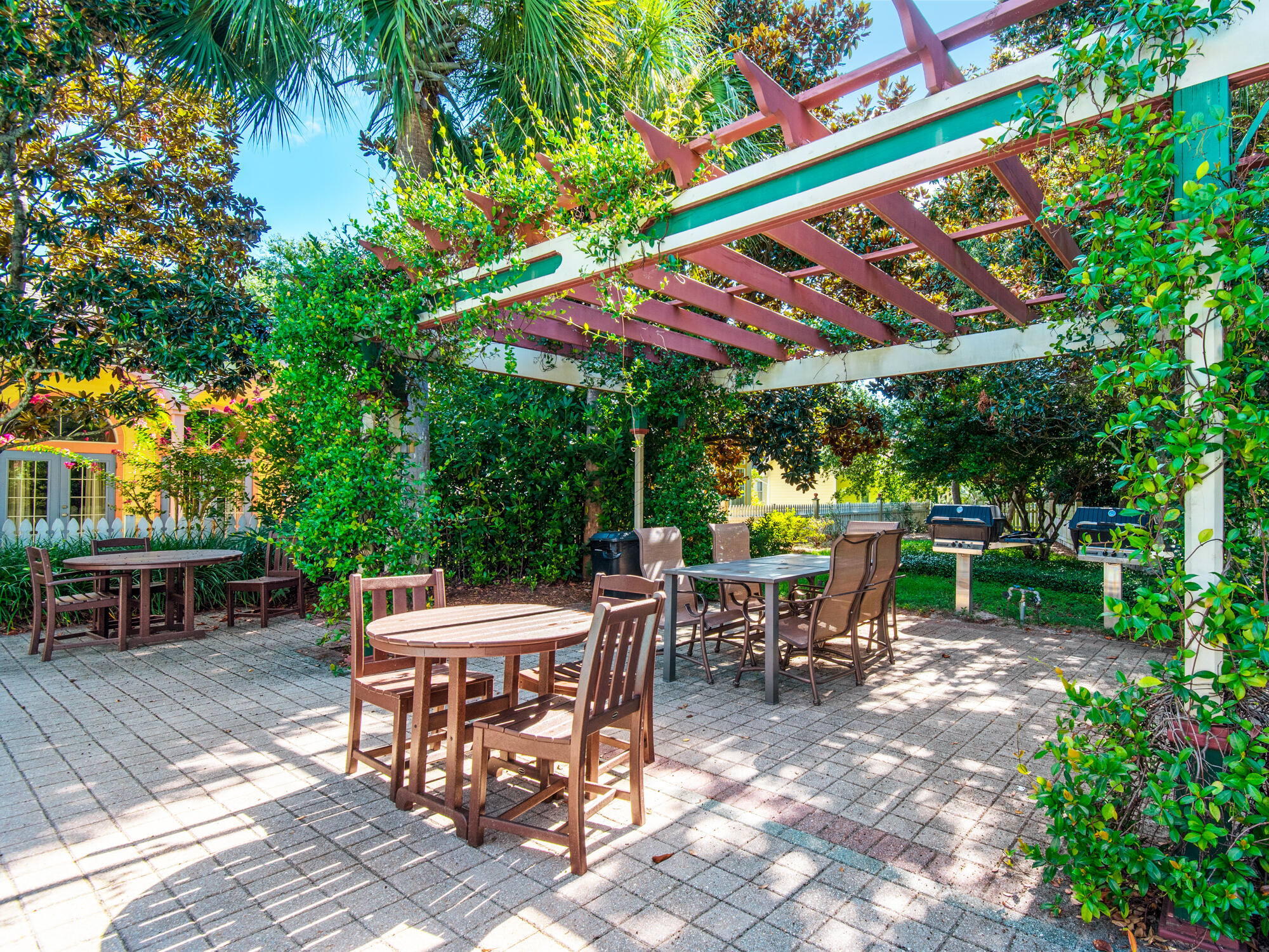4587 Woodwind Drive Destin, FL 32541 - Photo 23 of 24 an outdoor space with furniture and umbrella