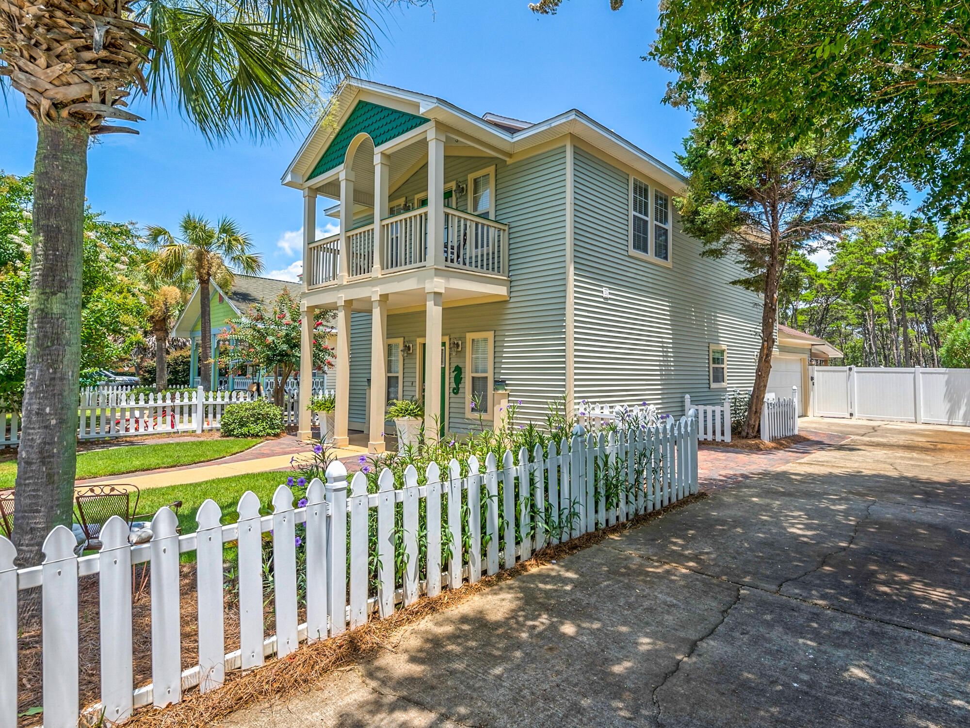 4587 Woodwind Drive Destin, FL 32541 - Photo 4 of 24 a front view of house with small garden