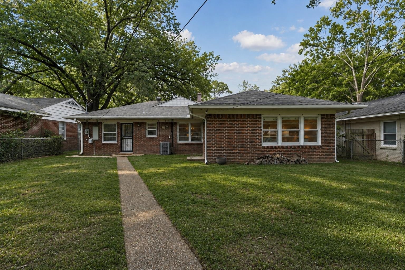 4491 Garnett Road Memphis, TN 38117 - Photo 26 of 32 Brick exterior featuring a gabled roof and white window trim