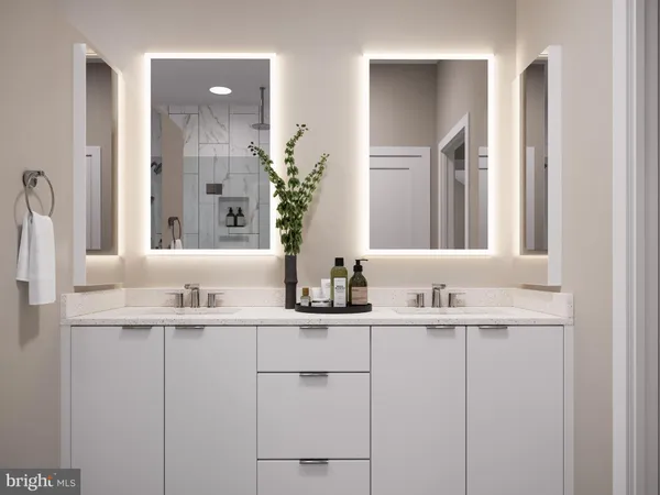a bathroom with double sink and a mirror