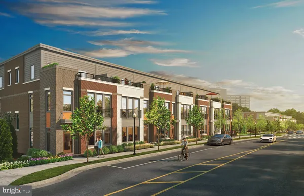 a building exterior with yard and glass door