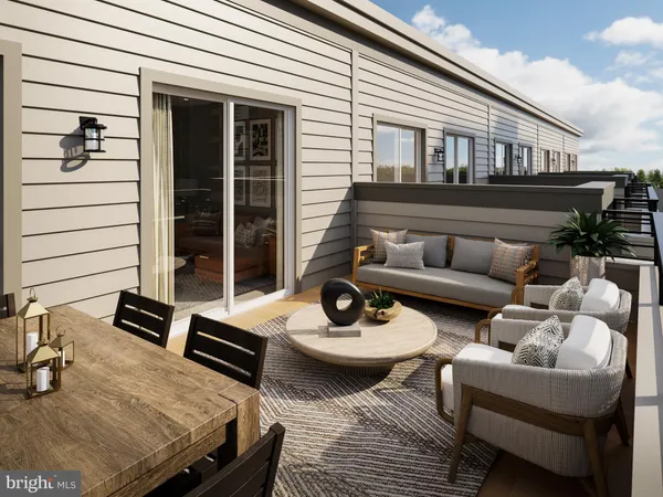 a view of a patio with couches table and chairs and potted plants