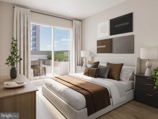 a bedroom with a large bed and a flat tv screen on dresser