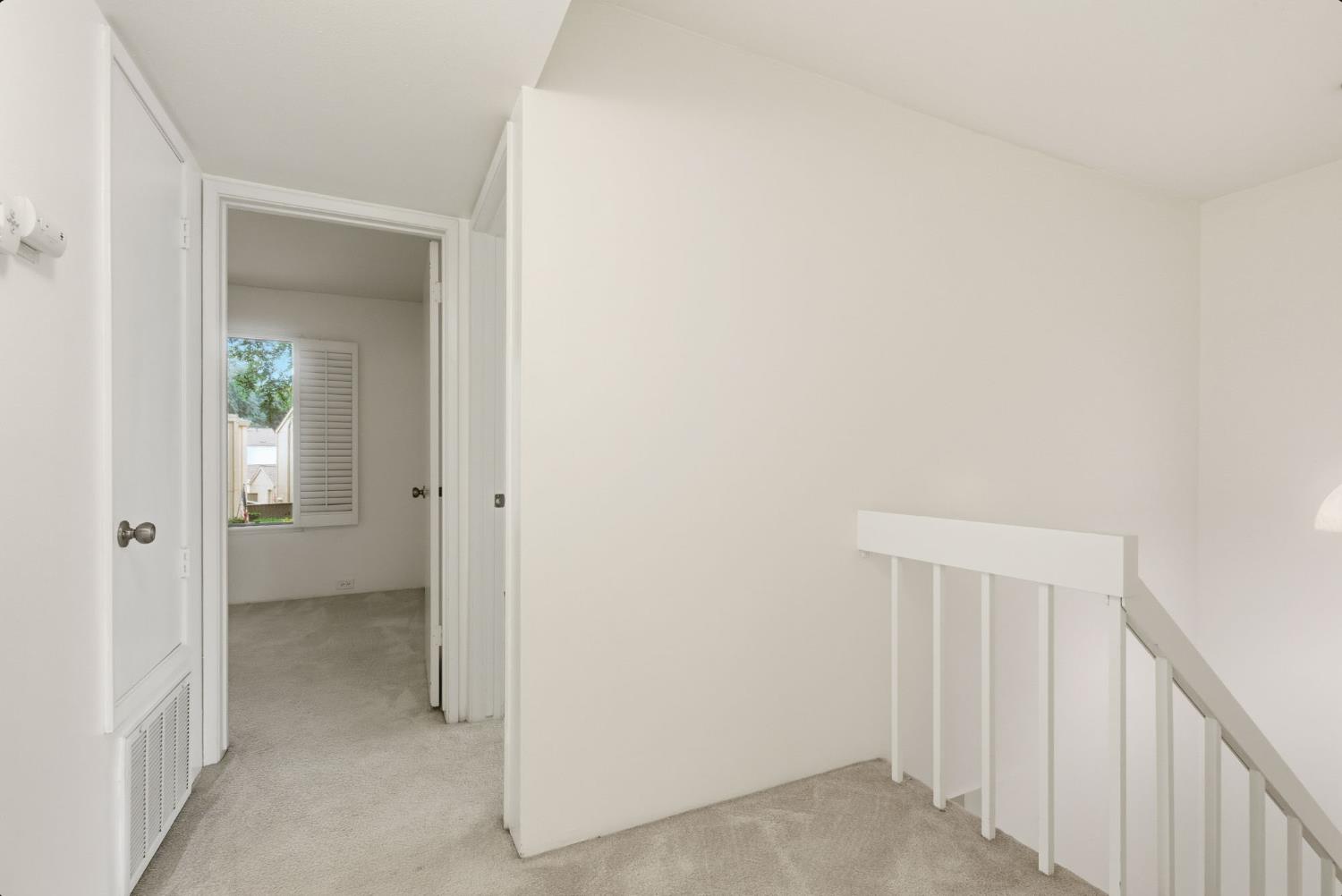 524 Hartnell Place Sacramento, CA 95825 - Photo 17 of 25 a view of a hallway with a wooden cabinets