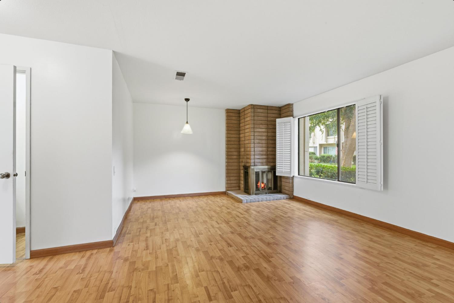 524 Hartnell Place Sacramento, CA 95825 - Photo 4 of 25 a view of an empty room with a window and wooden floor